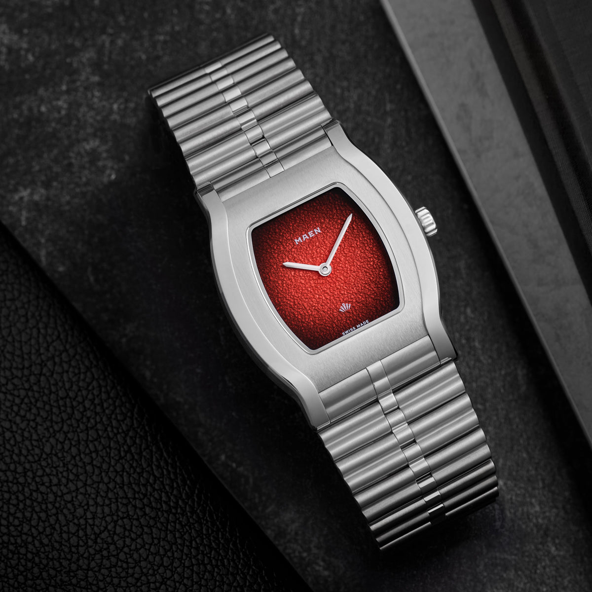 Grand Tonneau Ultra-Thin MNL.05 Lava Red Fumé on the bamboo bracelet