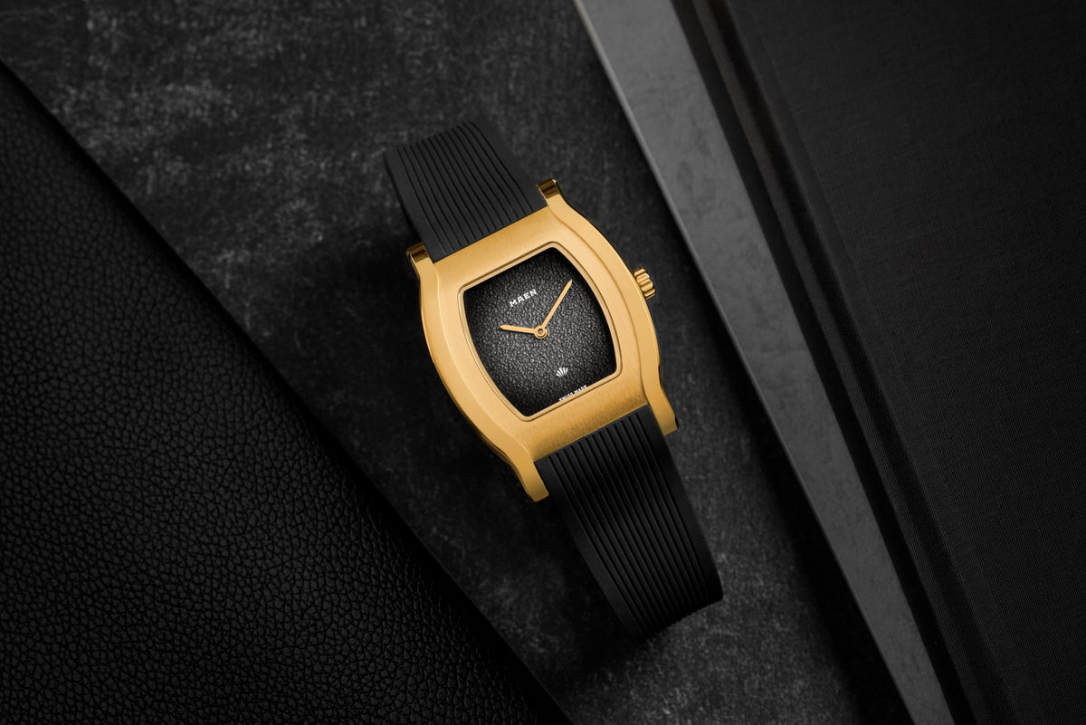 Grand Tonneau Ultra-Thin MNL.06 Black Fumé, gold-plated case on its rubber strap