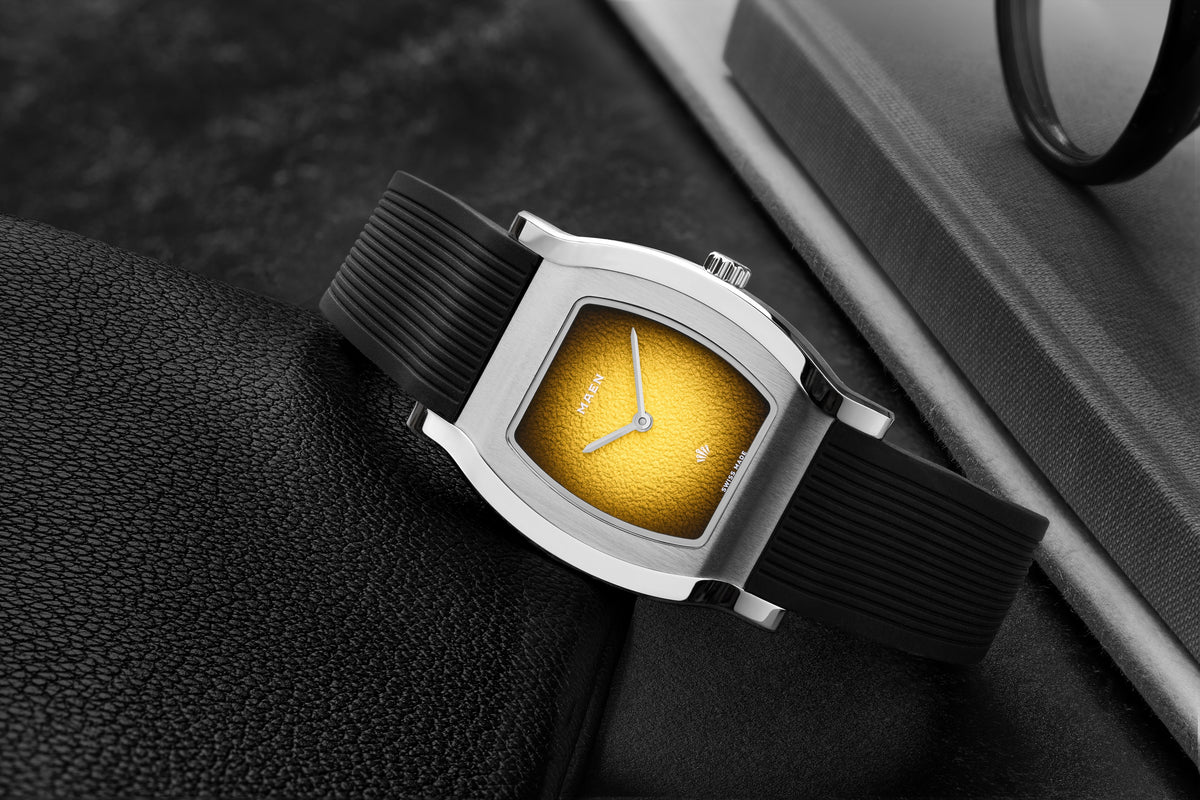Grand Tonneau Ultra-Thin MNL.08 Yellow Fumé on its rubber strap, close-up