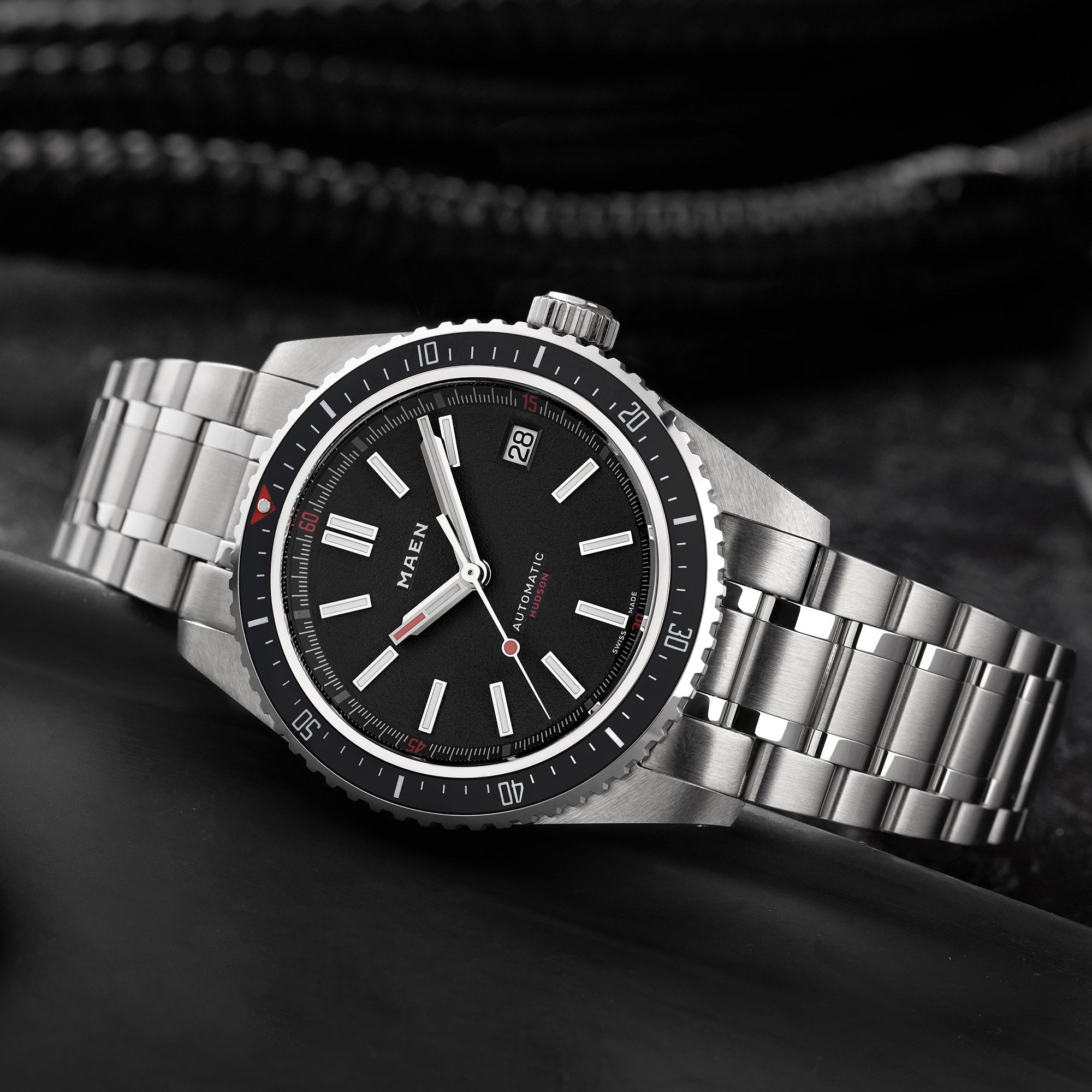 MAEN Hudson 38 MK5 black on a steel bracelet photographed from above